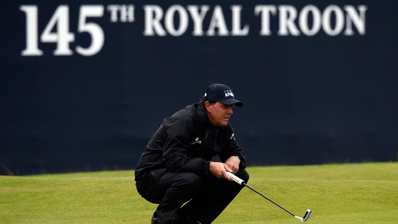 US golfer Phil Mickelson lines up a putt on the 18th green during his second round 69 on day two of the 2016 British Open Golf Championship at Royal Troon in Scotland on July 15, 2016. Phil Mickelson held his lead at the British Open on Friday after a second-round 69 left him at 10 under par heading into the weekend. ANDY BUCHANAN / AFP